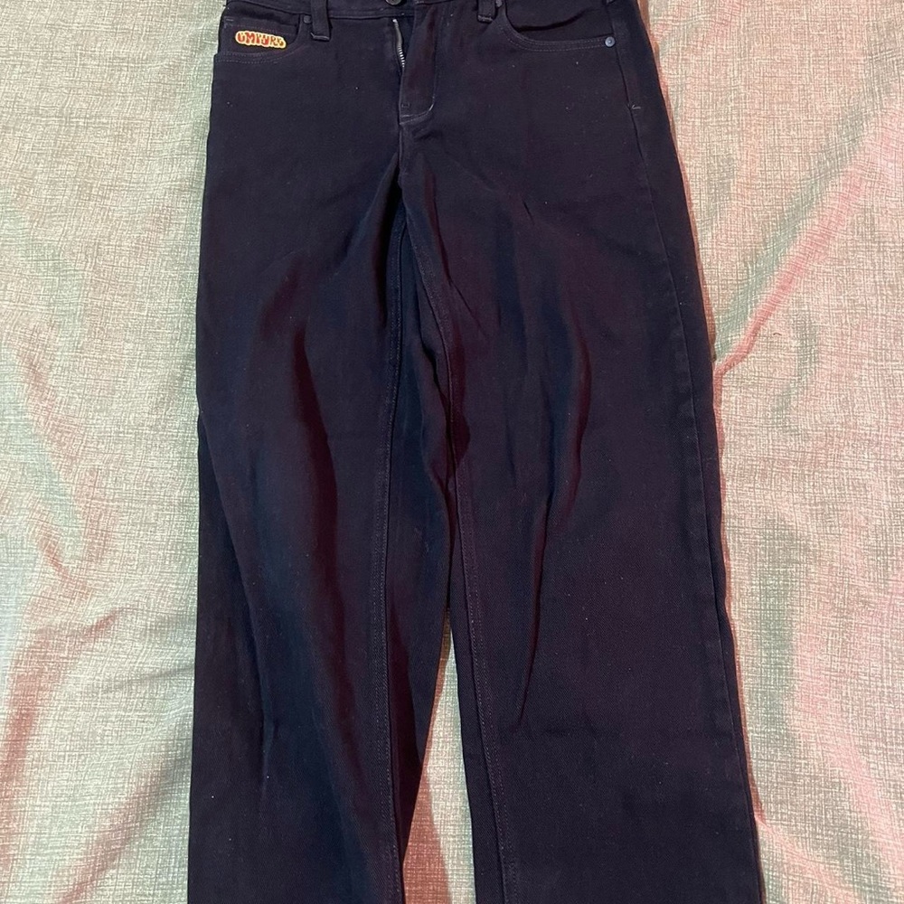 Loose black jeans. Fit a size 27 men’s